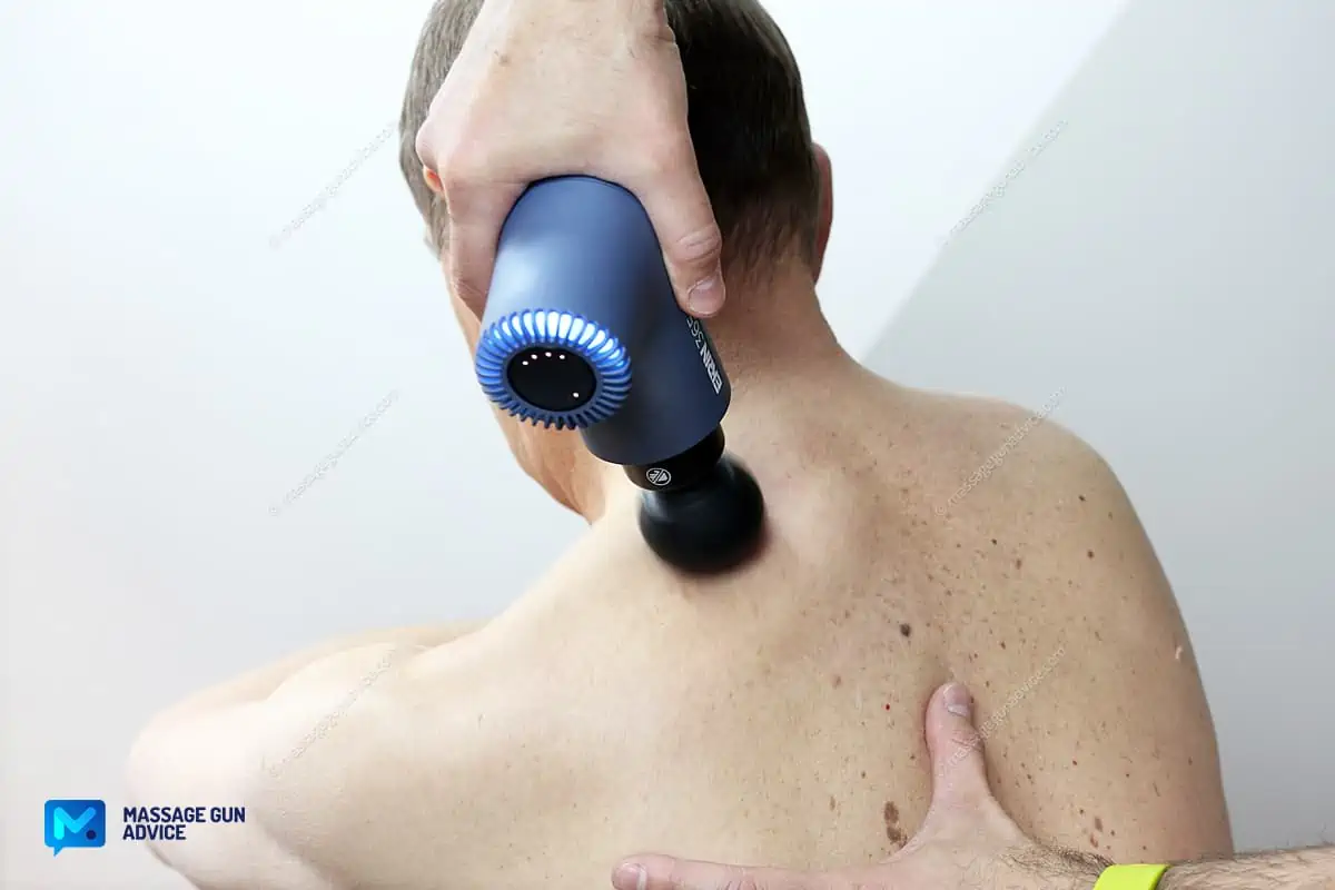 Back pain massage using Ekrin 365 massage gun for old people