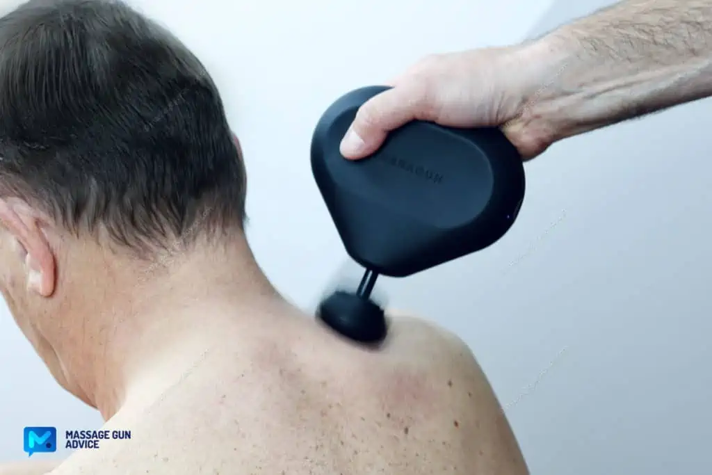 Back pain massage using theragun mini