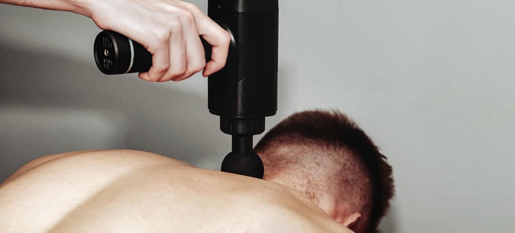 massage gun on back of neck