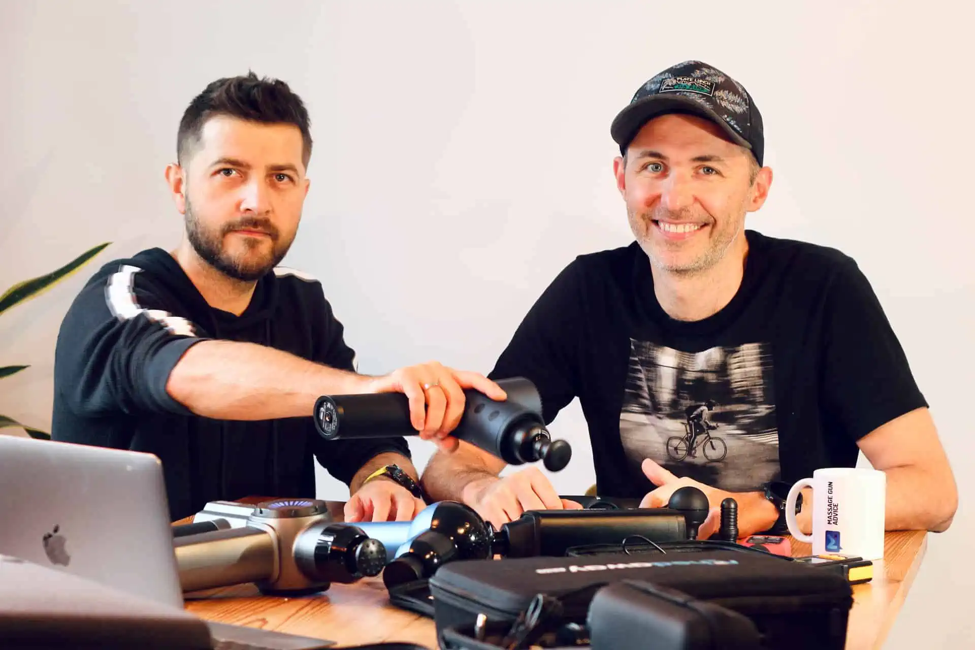 Greg Szostak And Luke Deszczulka Doing A Massage Gun Tests